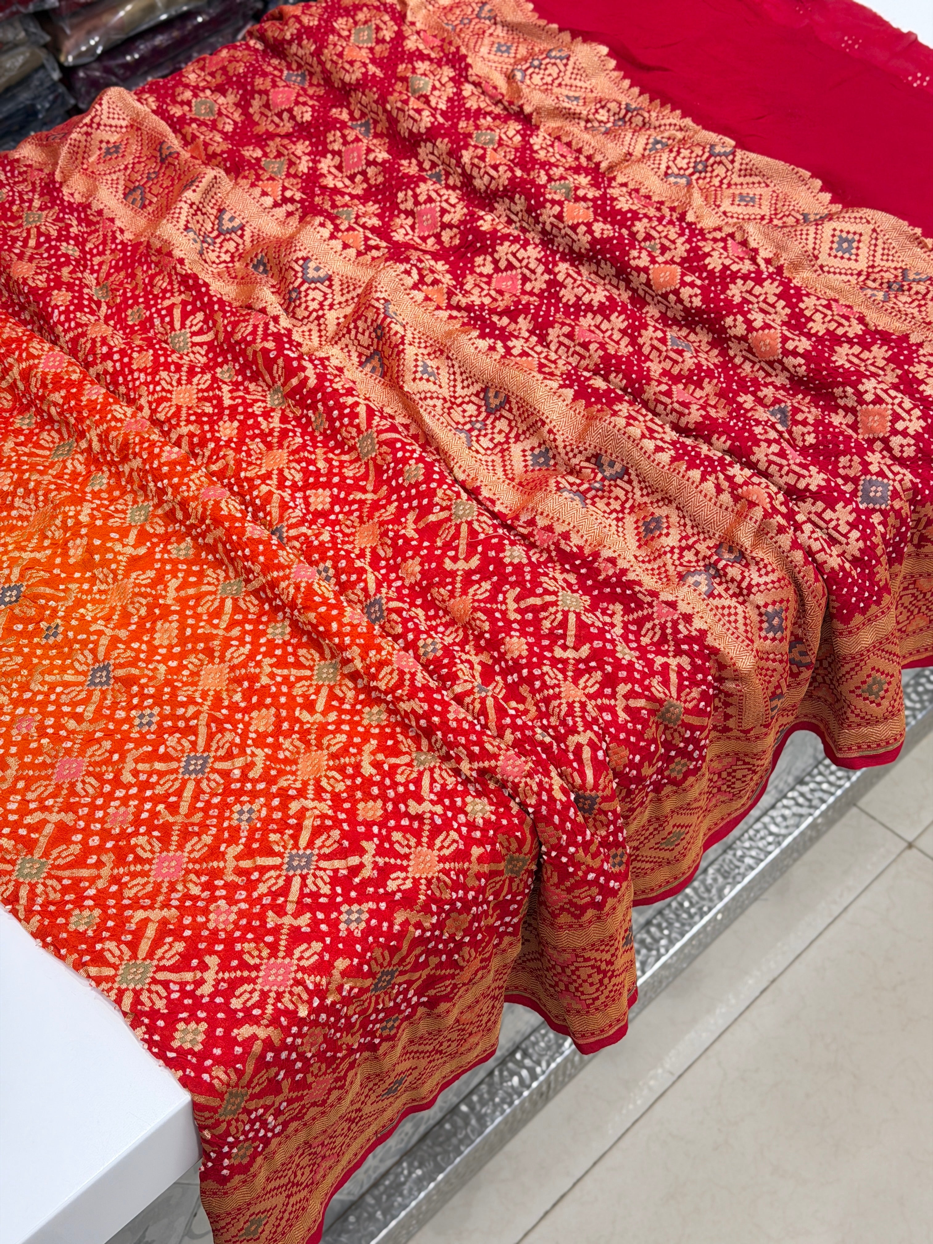 Shaded Orange Red Patola Weave Meenakari Georgette Bandhej Saree