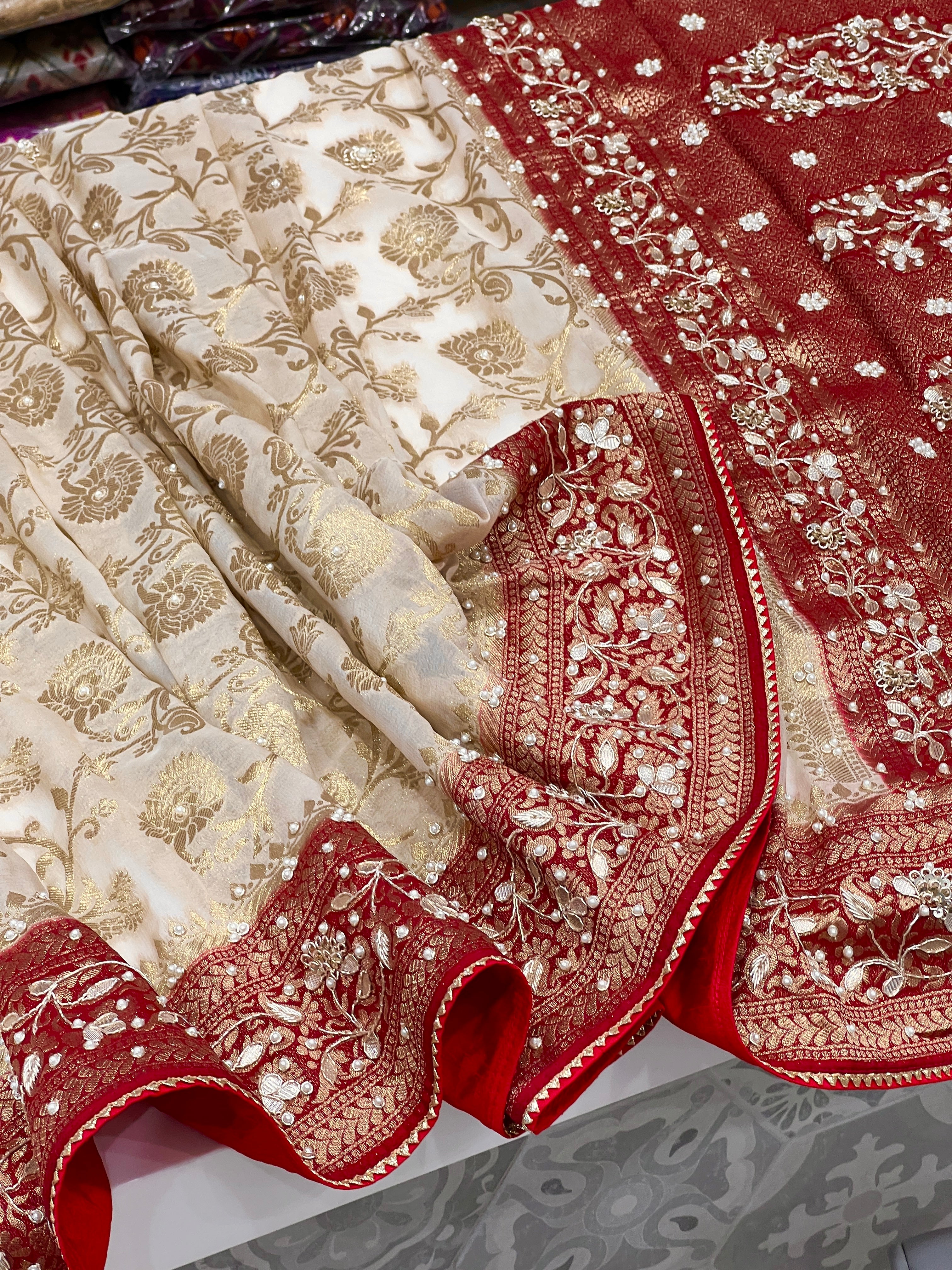 Beige Georgette Jaal Saree with Moti Hand Embroidery and Red Border