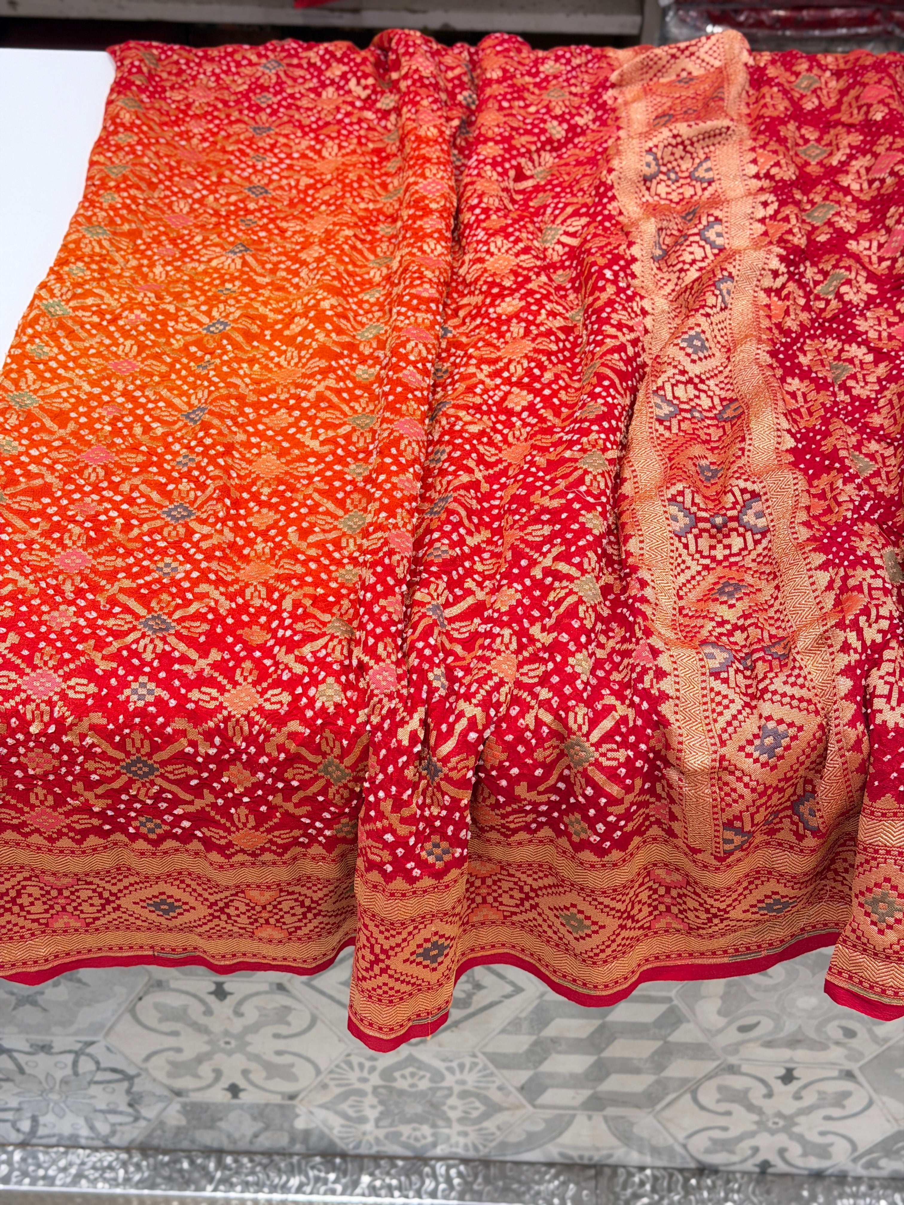 Shaded Orange Red Patola Weave Meenakari Georgette Bandhej Saree