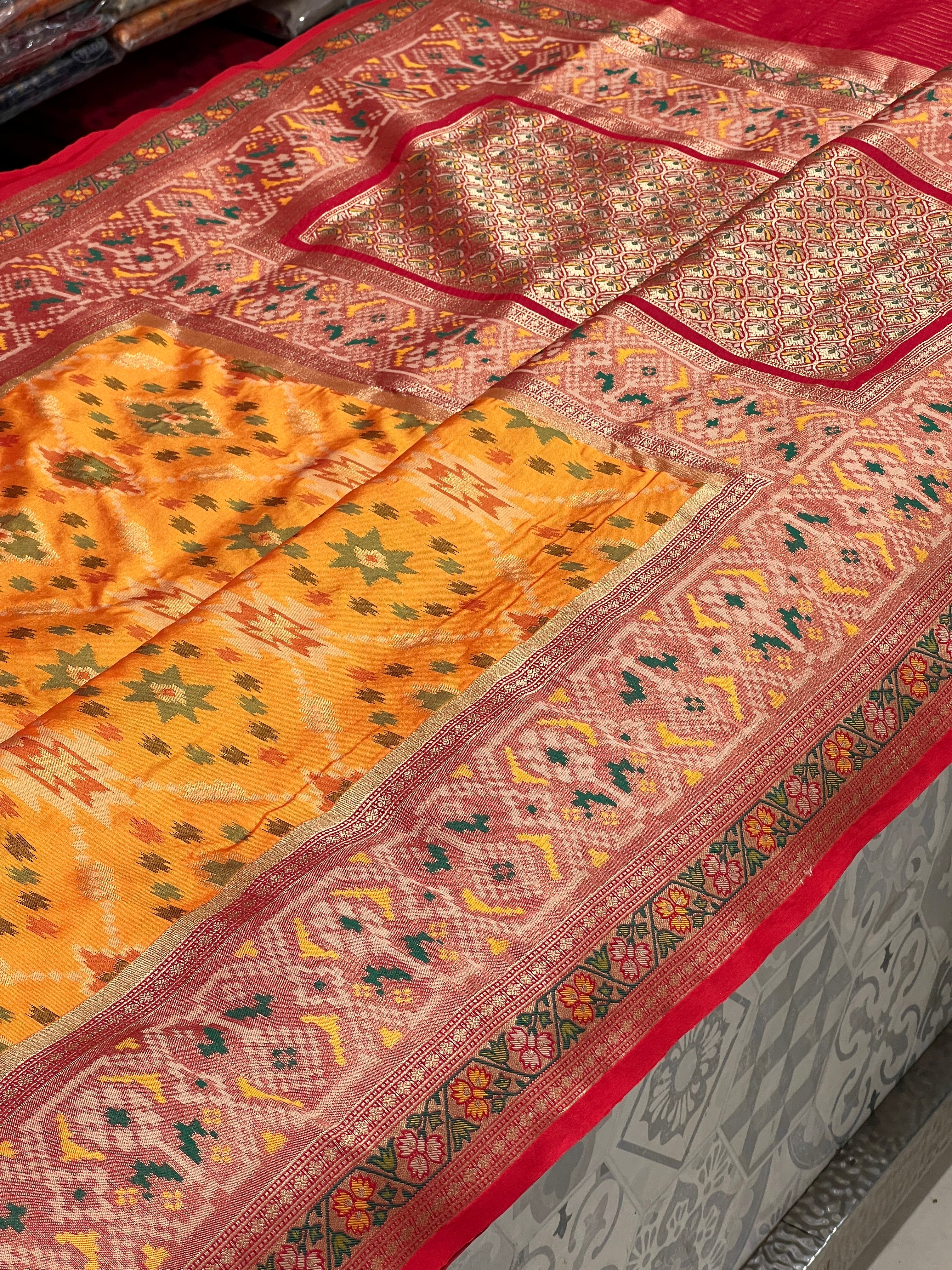 Light Orange Patola Saree with Contrast Blouse