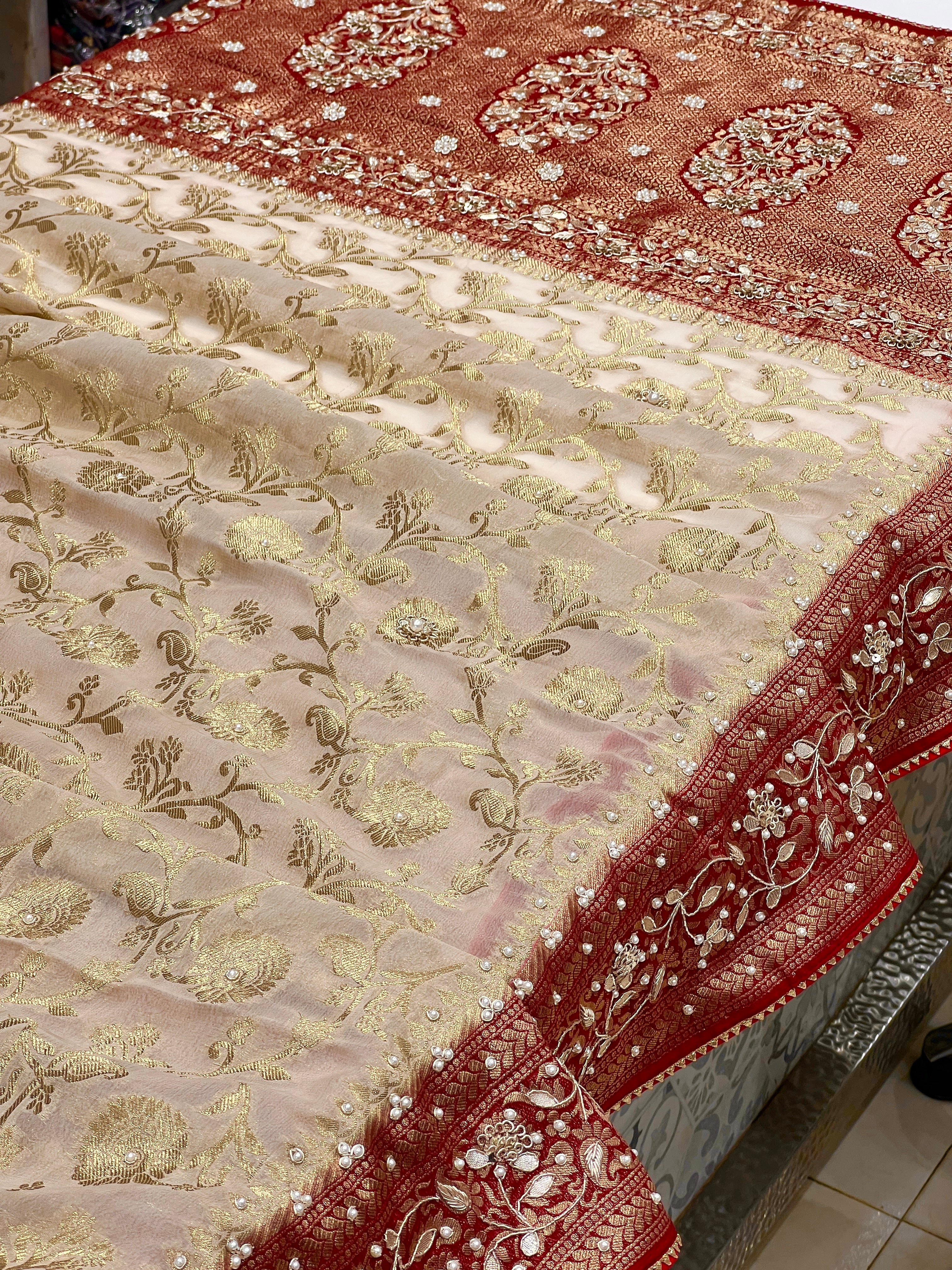 Beige Georgette Jaal Saree with Moti Hand Embroidery and Red Border