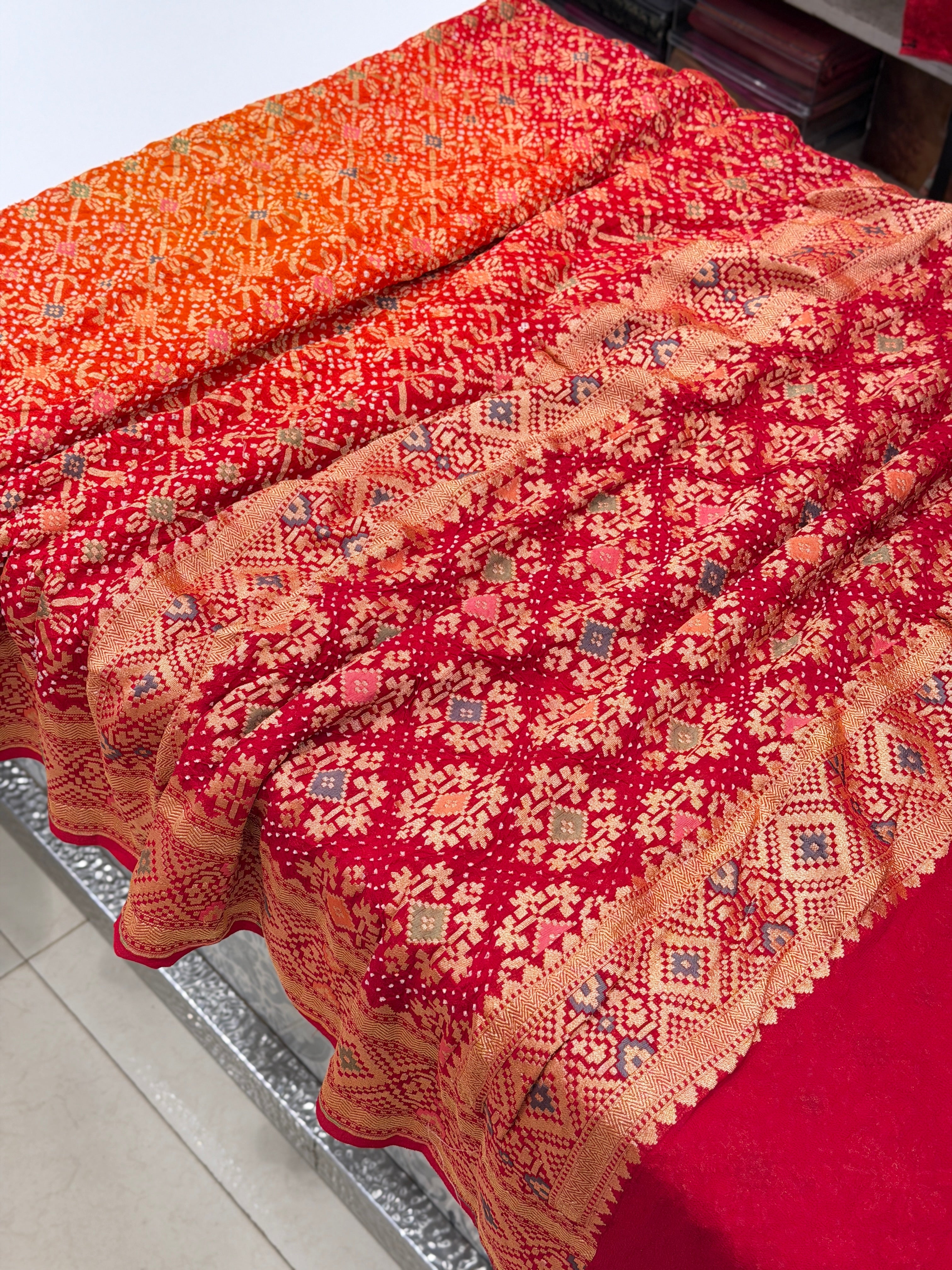 Shaded Orange Red Patola Weave Meenakari Georgette Bandhej Saree