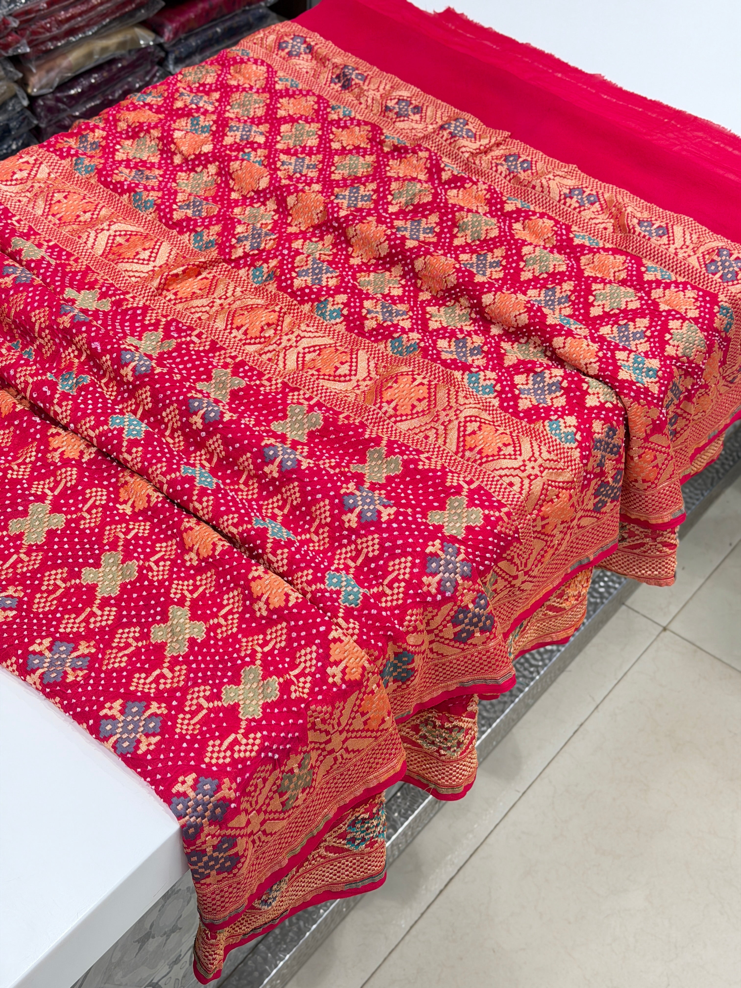 Crimson Rani Patola Weave Meenakari Georgette Bandhej Saree