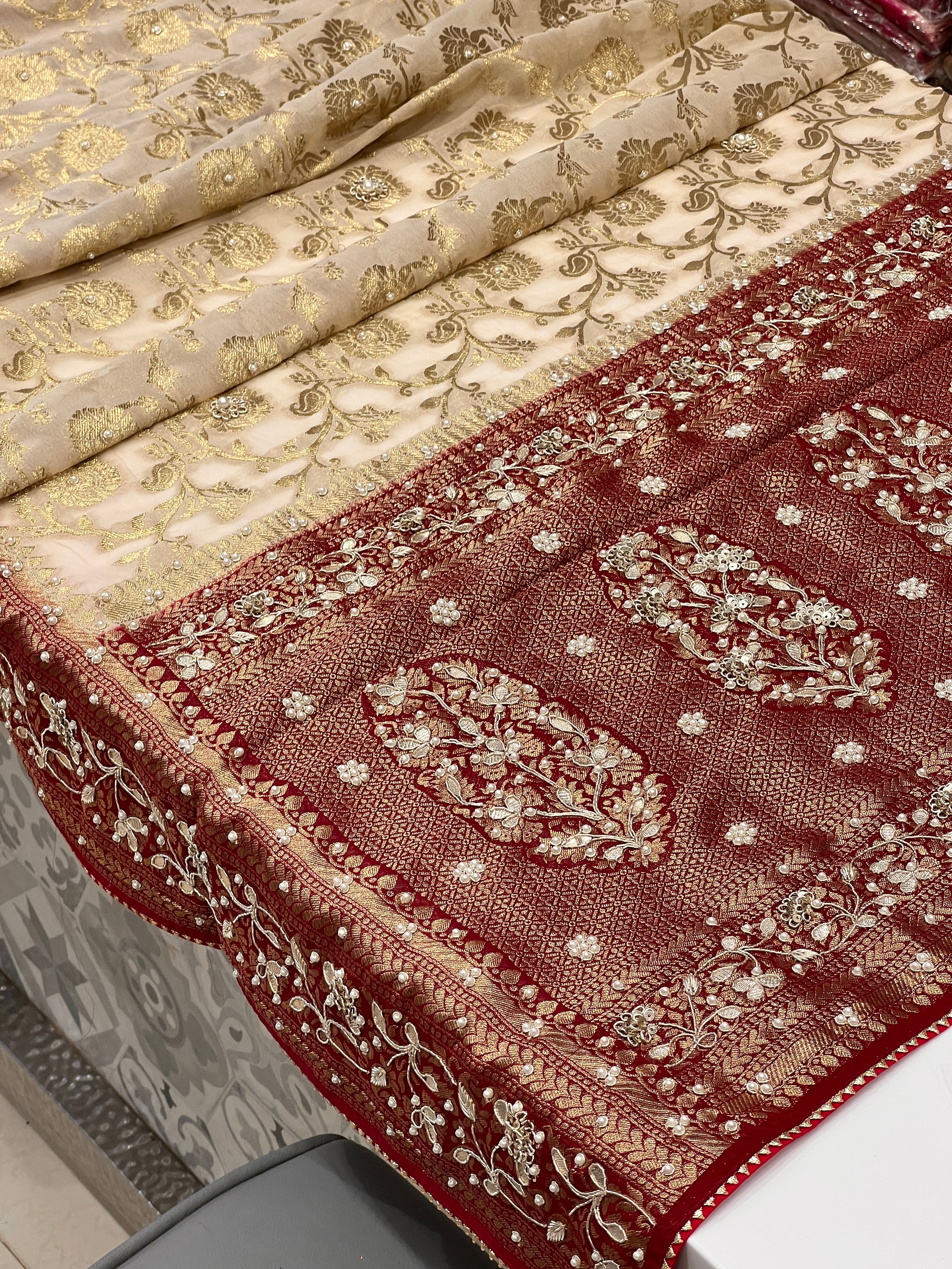 Beige Georgette Jaal Saree with Moti Hand Embroidery and Red Border