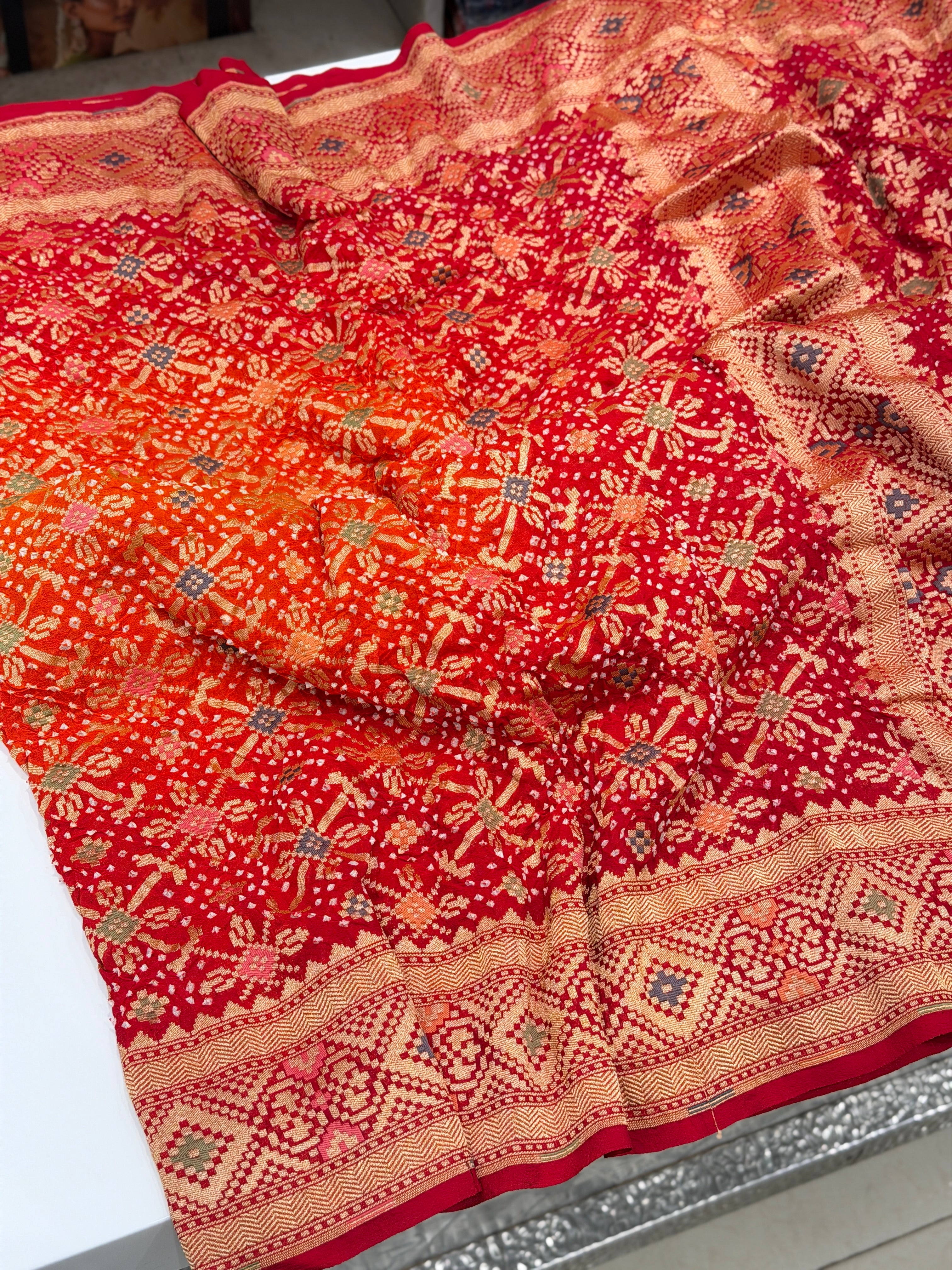 Shaded Orange Red Patola Weave Meenakari Georgette Bandhej Saree