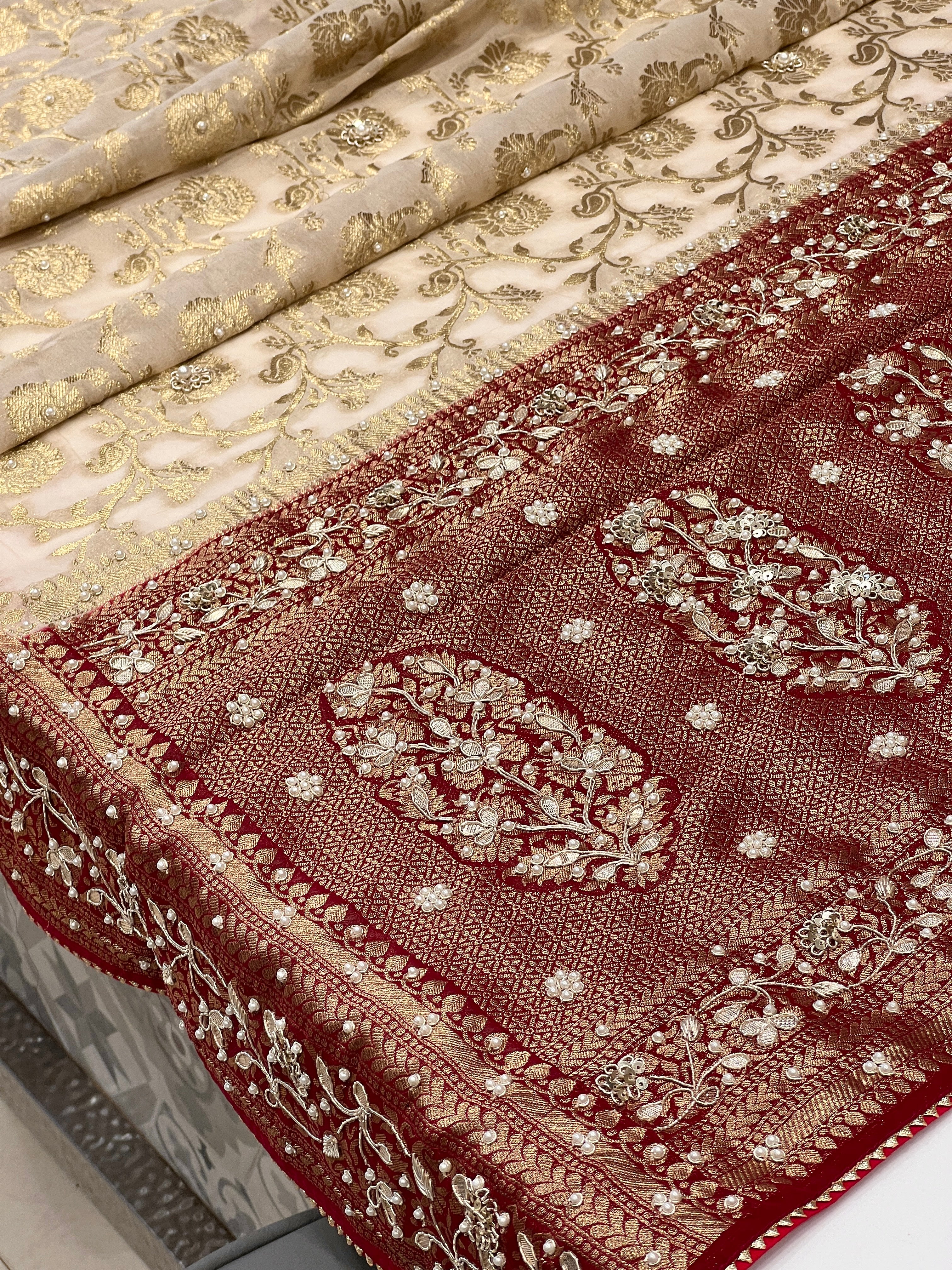Beige Georgette Jaal Saree with Moti Hand Embroidery and Red Border