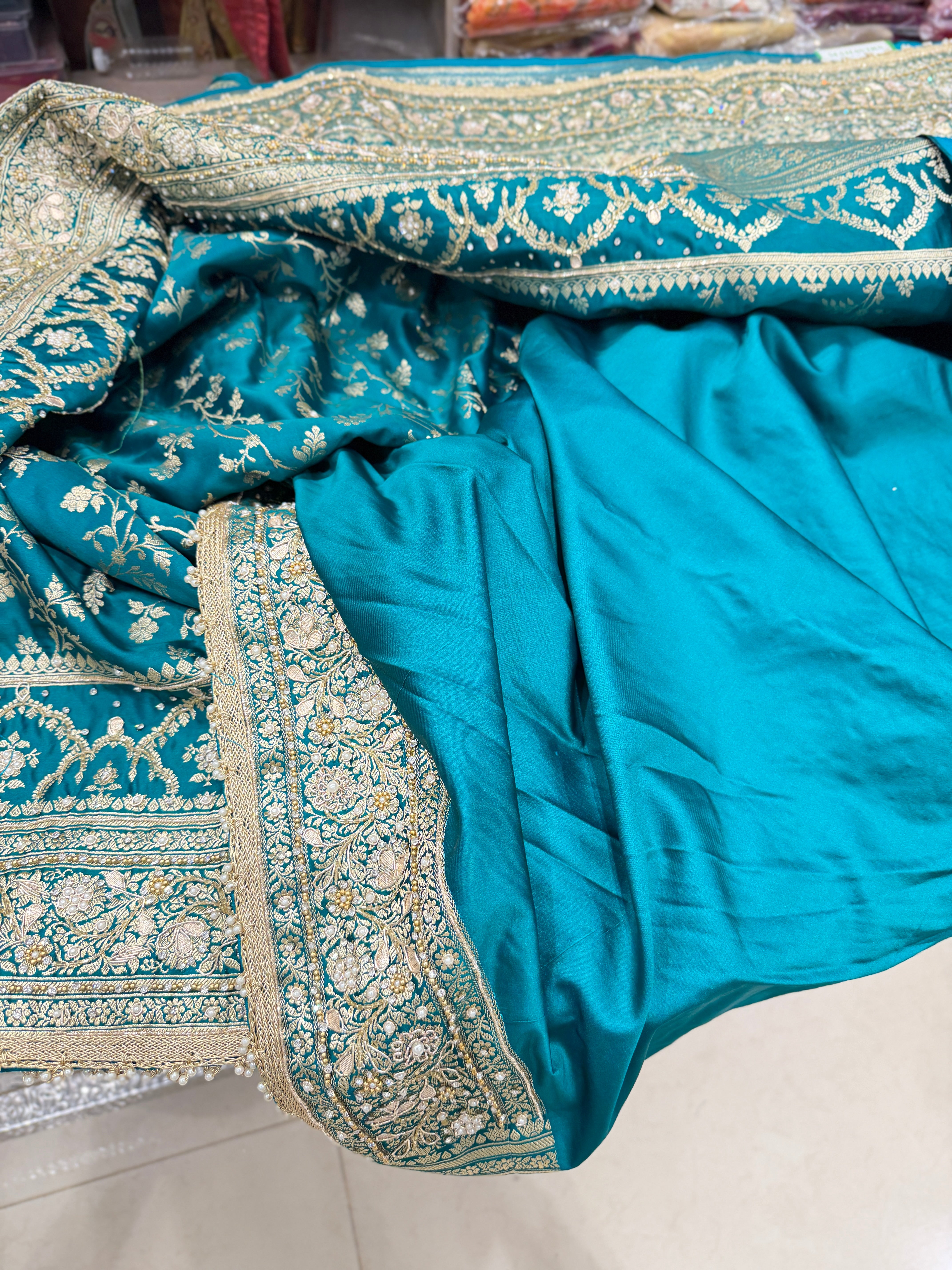 Warm Teal Green Banarasi Silk Crown Border Silk Embroidery Saree