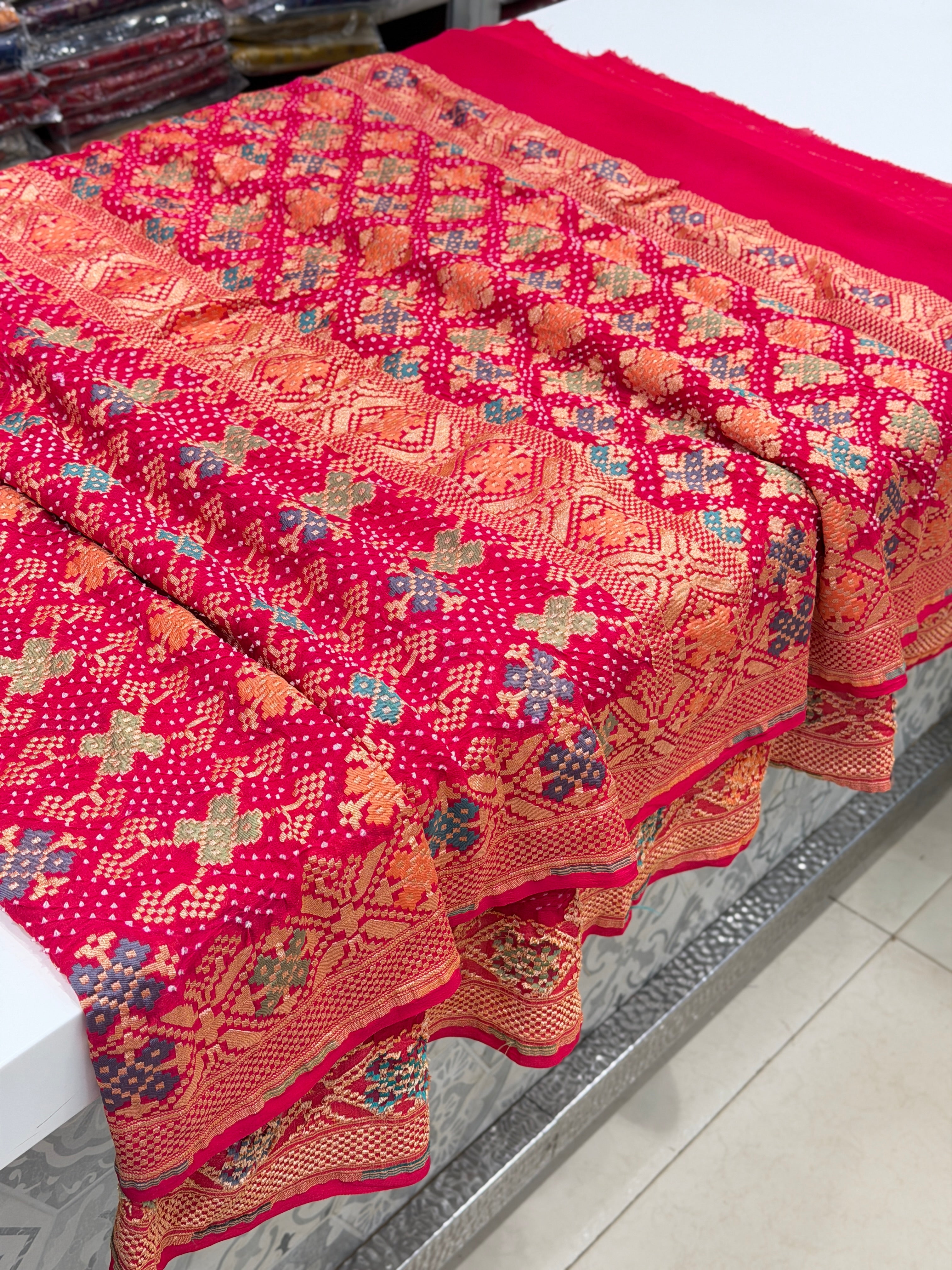 Crimson Rani Patola Weave Meenakari Georgette Bandhej Saree