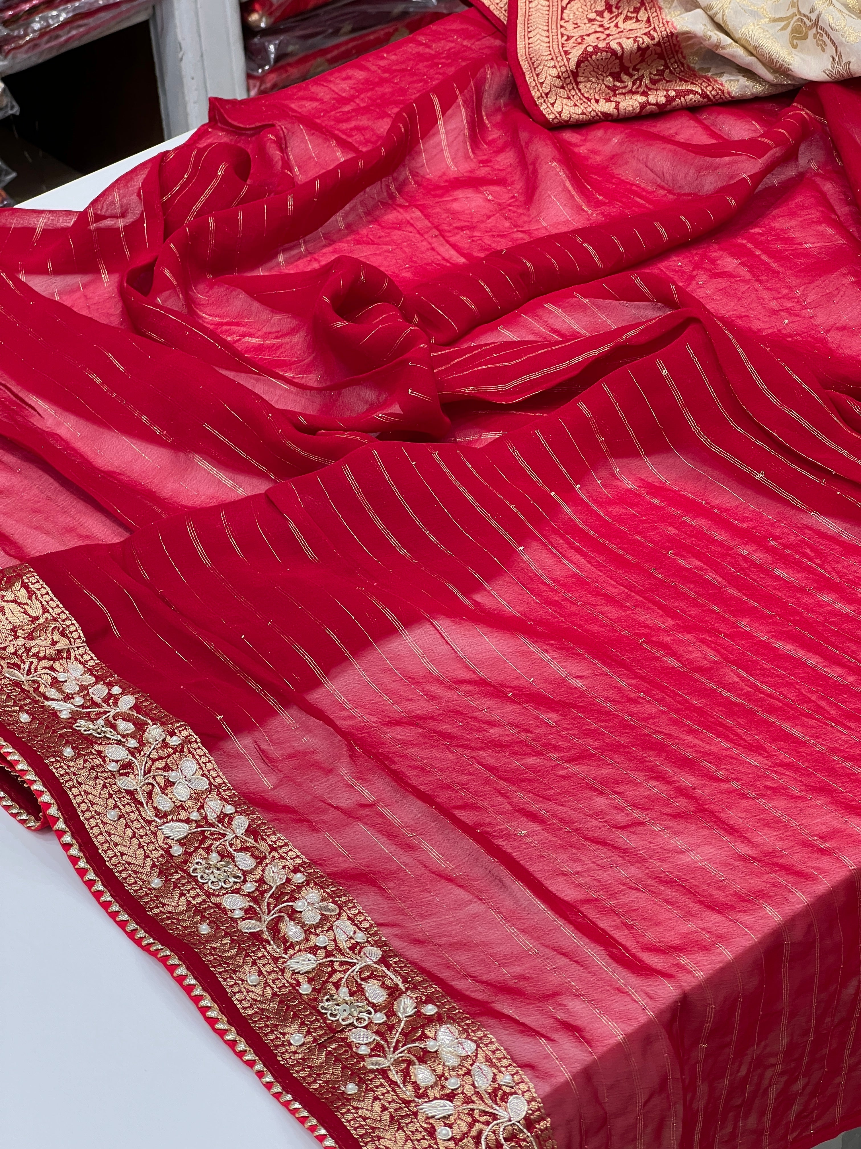 Beige Georgette Jaal Saree with Moti Hand Embroidery and Red Border