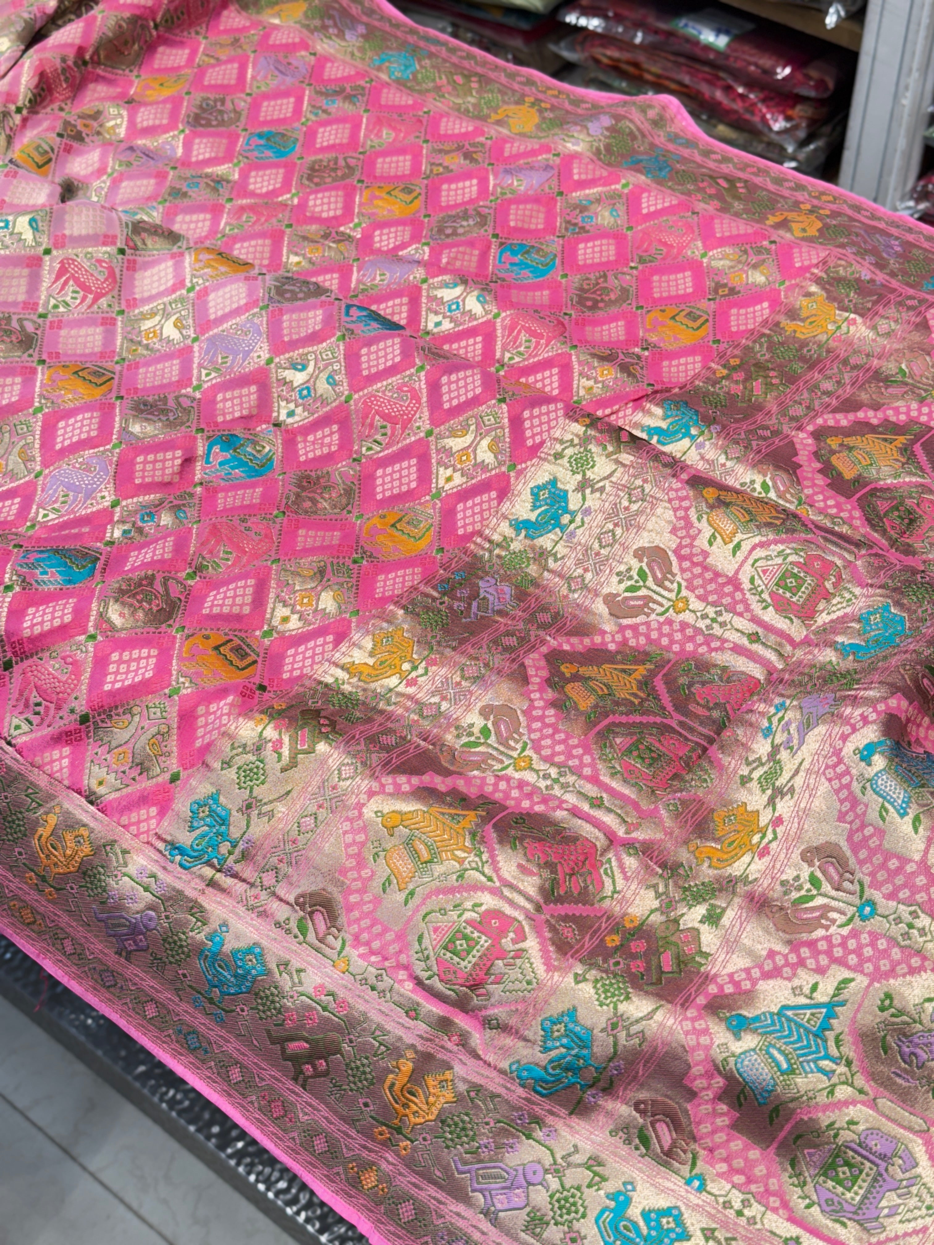 Shaded Pink Georgette Woven Bandhej Patola Saree