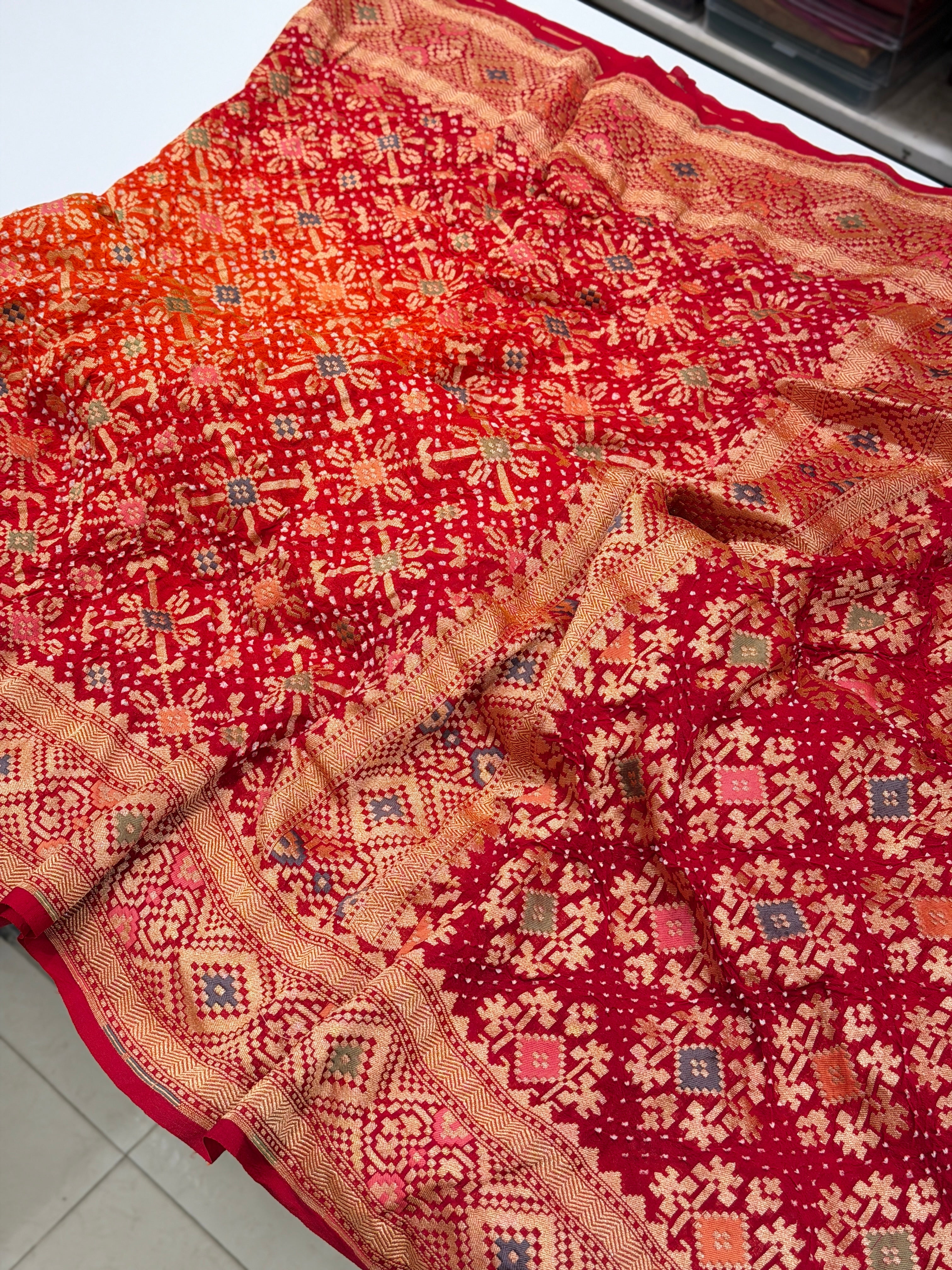 Shaded Orange Red Patola Weave Meenakari Georgette Bandhej Saree